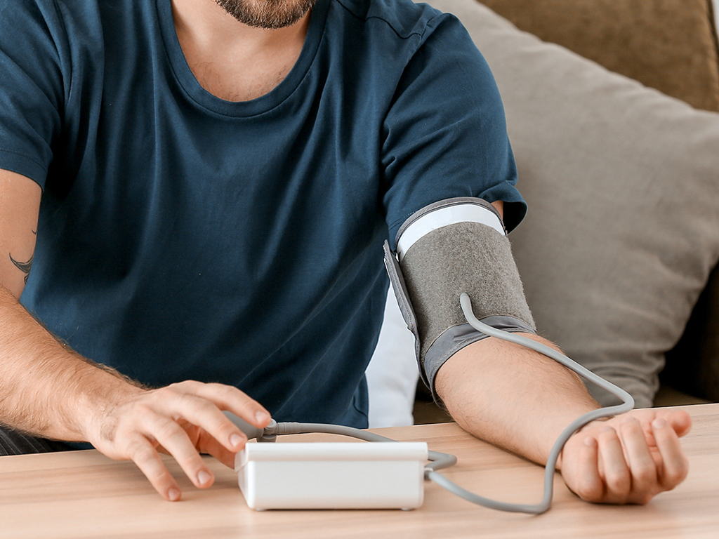 a man taking his blood pressure