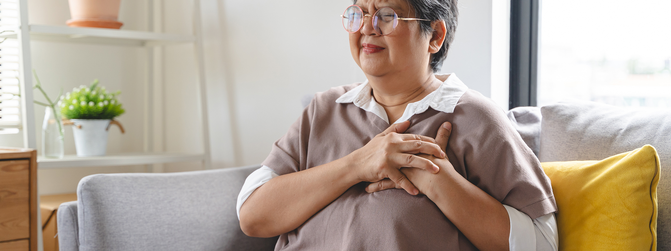 Woman holding her chest