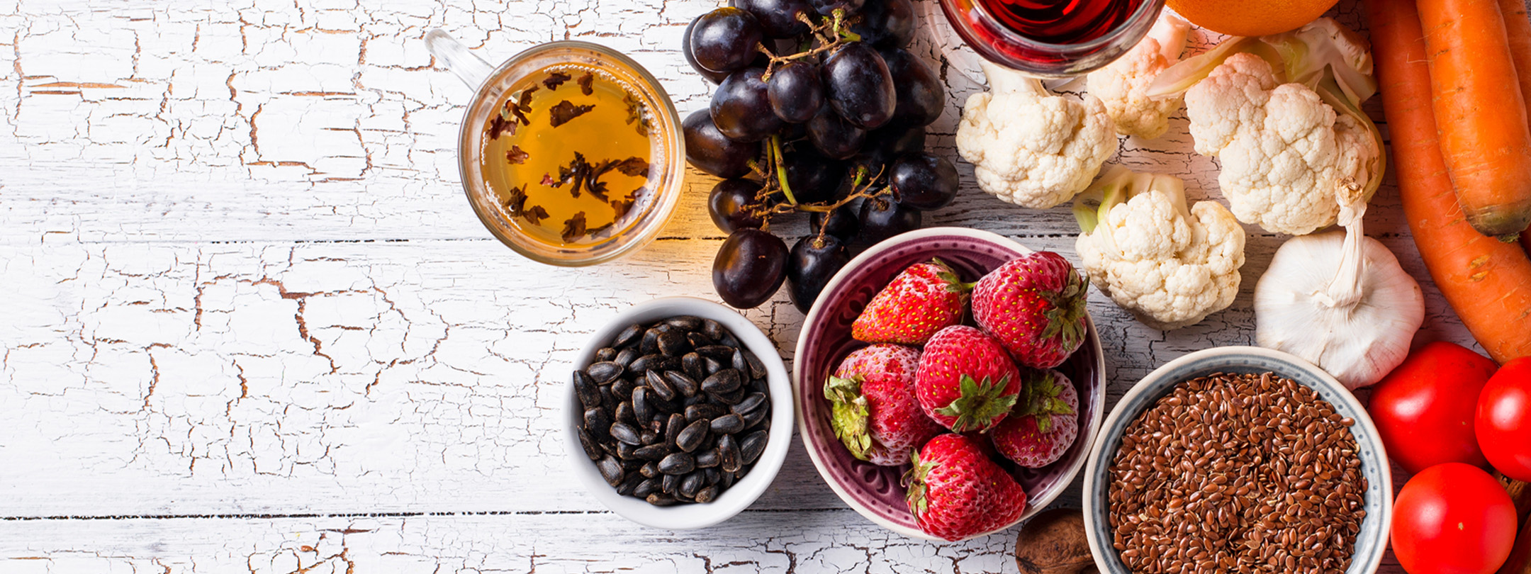 A spread of fruits and vegetables on a countertop
