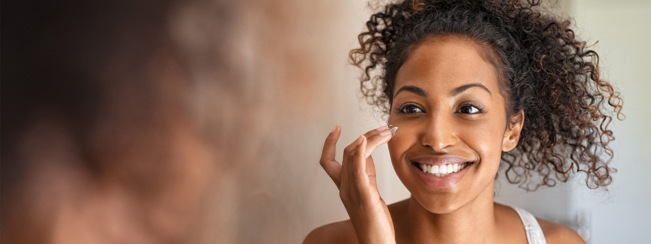 woman applying face cream